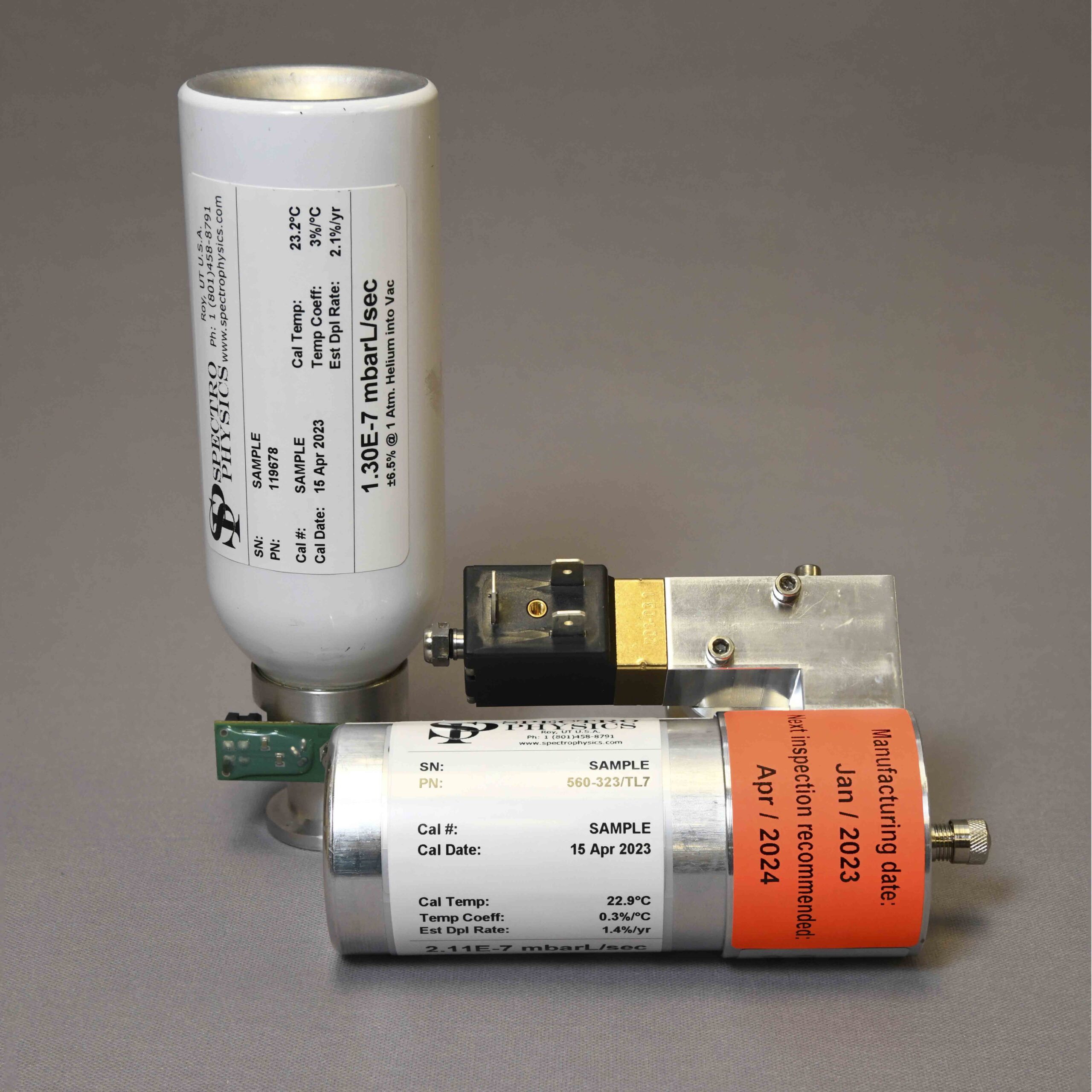 Two internal helium leak standards calibrated by Spectro Physics, manufactured by Pfeiffer Vacuum and Inficon.