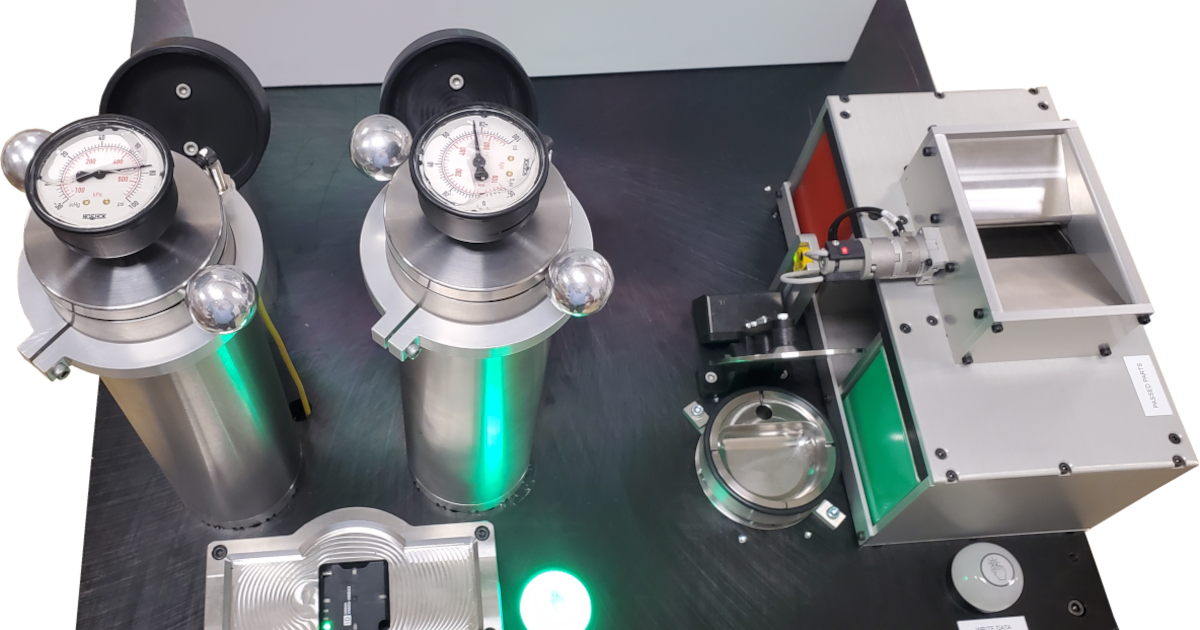 Helium bombing machine tabletop with bombing chambers and helium test chamber.