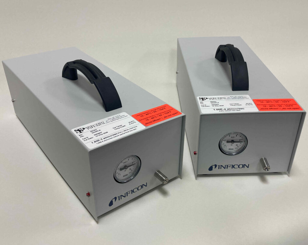 Two Inficon sniffer box leaks calibrated by Spectro Physics for helium and helium/hydrogen blend tracer gases.
