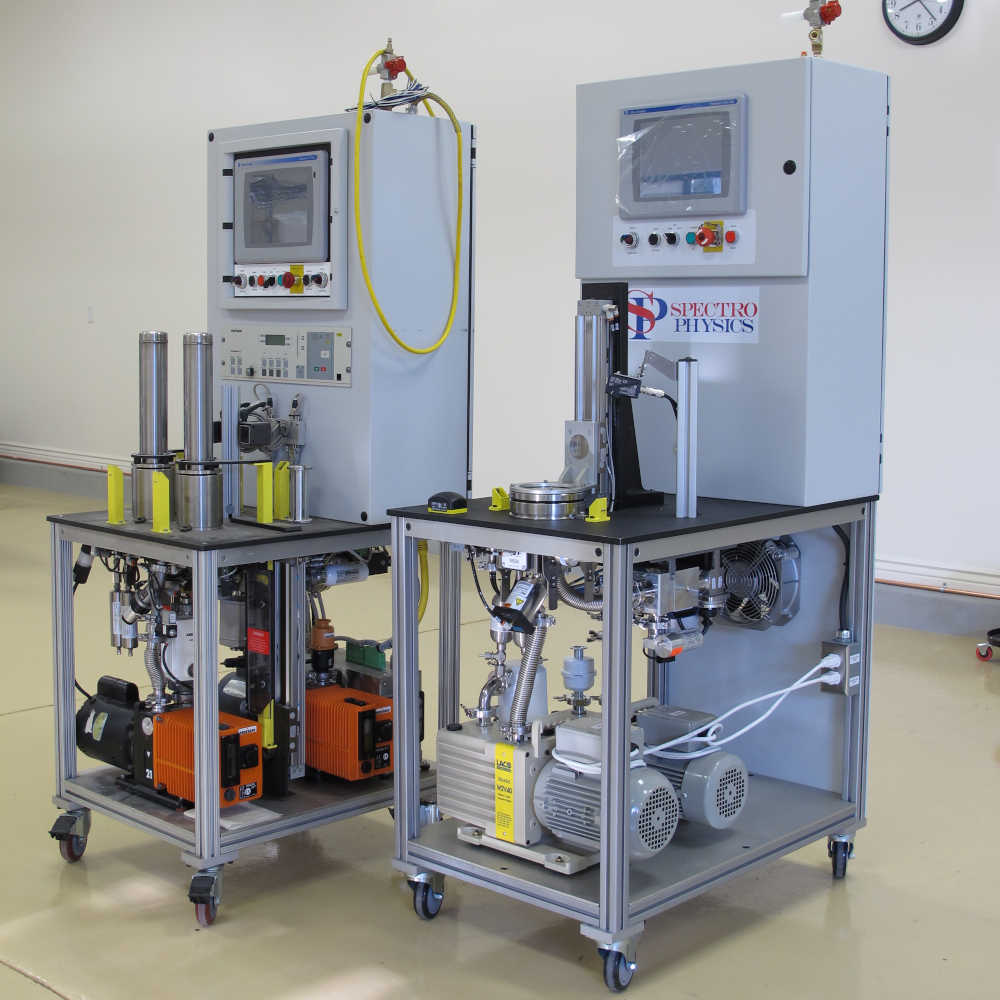 Two different helium leak detection systems manufactured by Spectro Physics